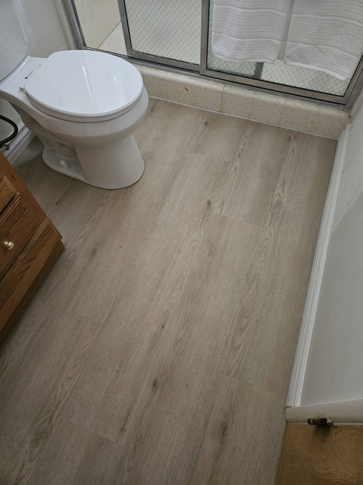 New tile flooring installed in a bathroom