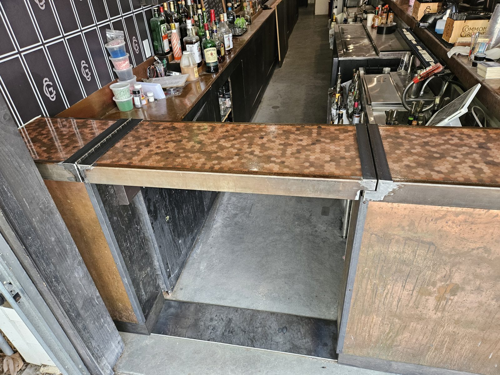 Custom bar with a hinged wood top