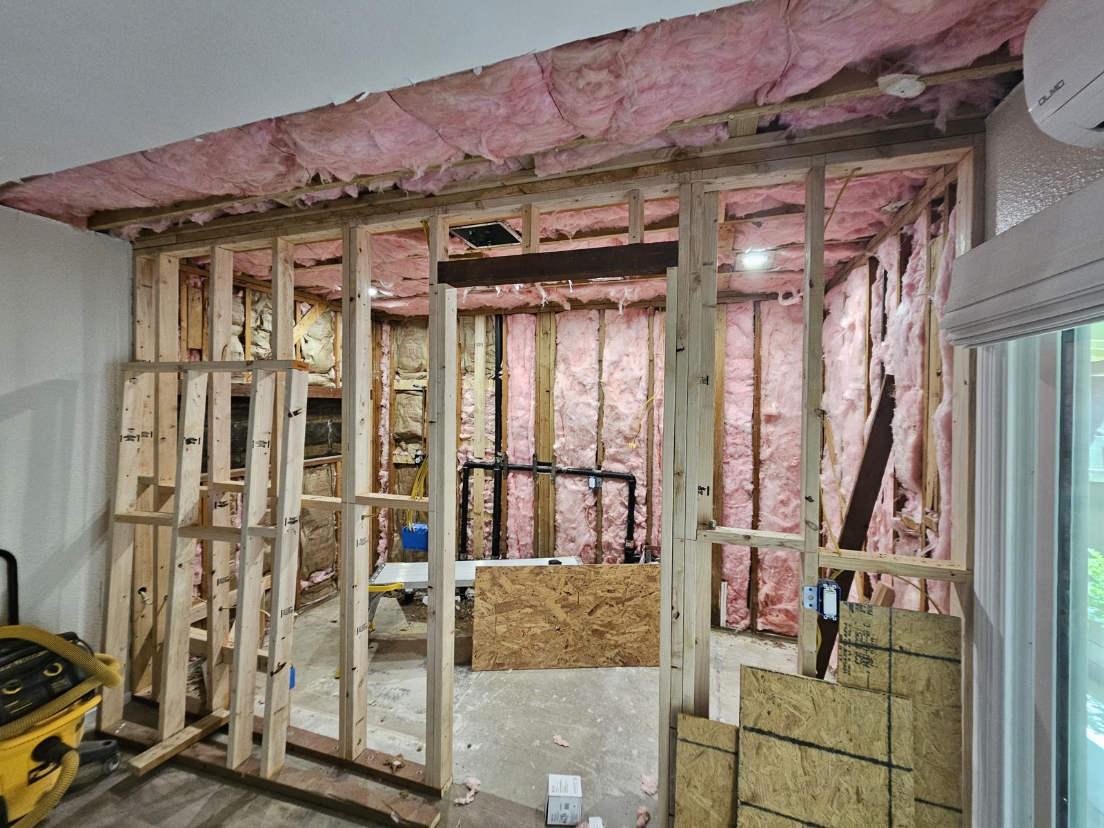 Bathroom addition under construction with new framing