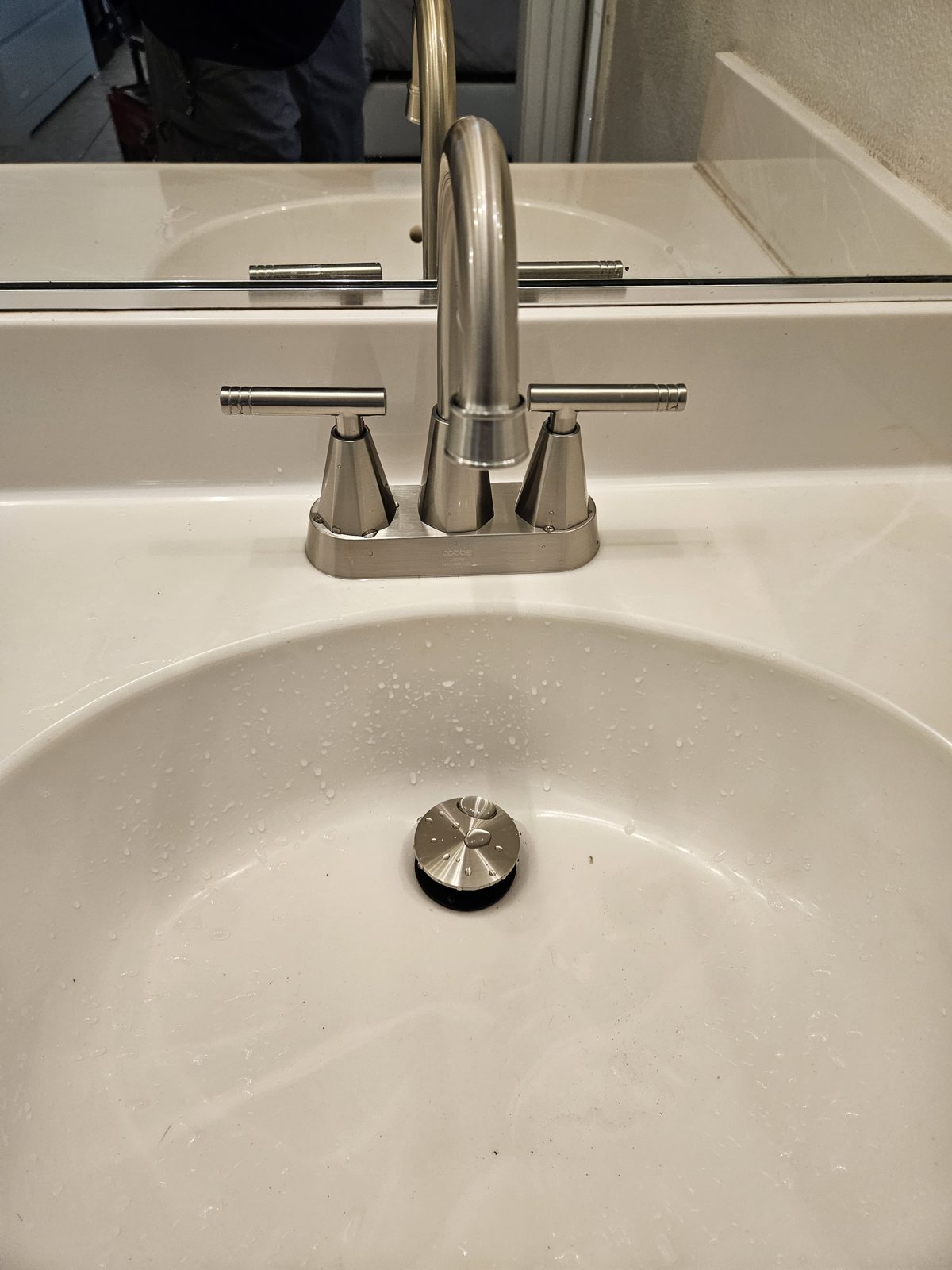New faucet installed on a bathroom vanity
