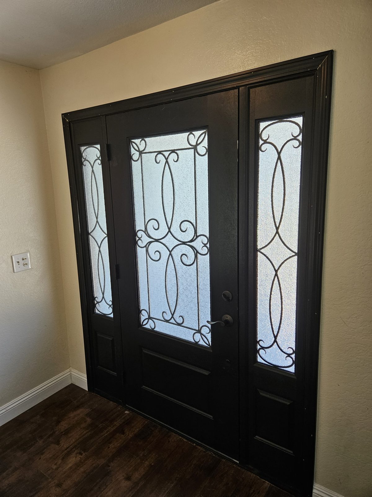 Exterior entry door installed with sidelights
