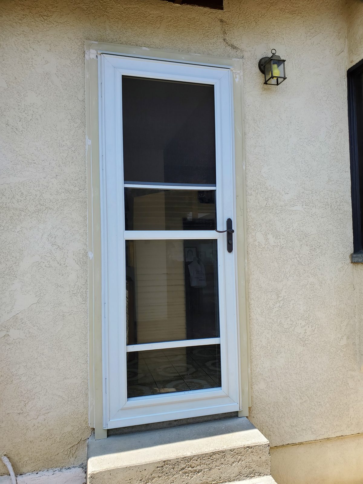 New storm door installed at an entry