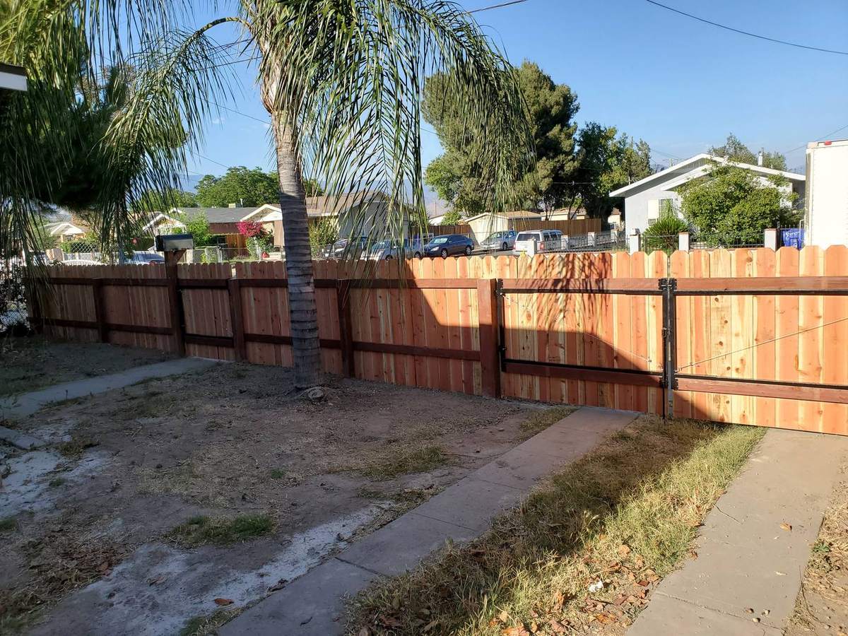 Wood privacy fence built with a matching gate