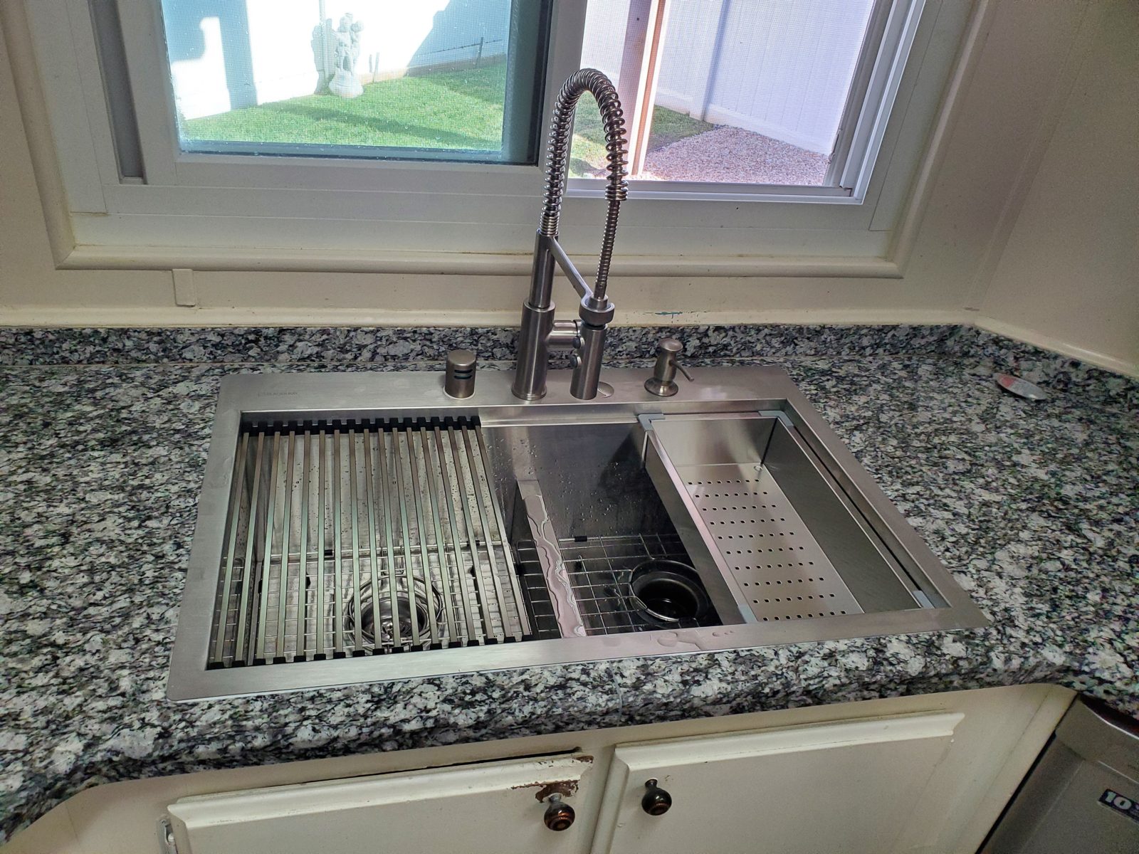 Workstation sink installed in a kitchen counter