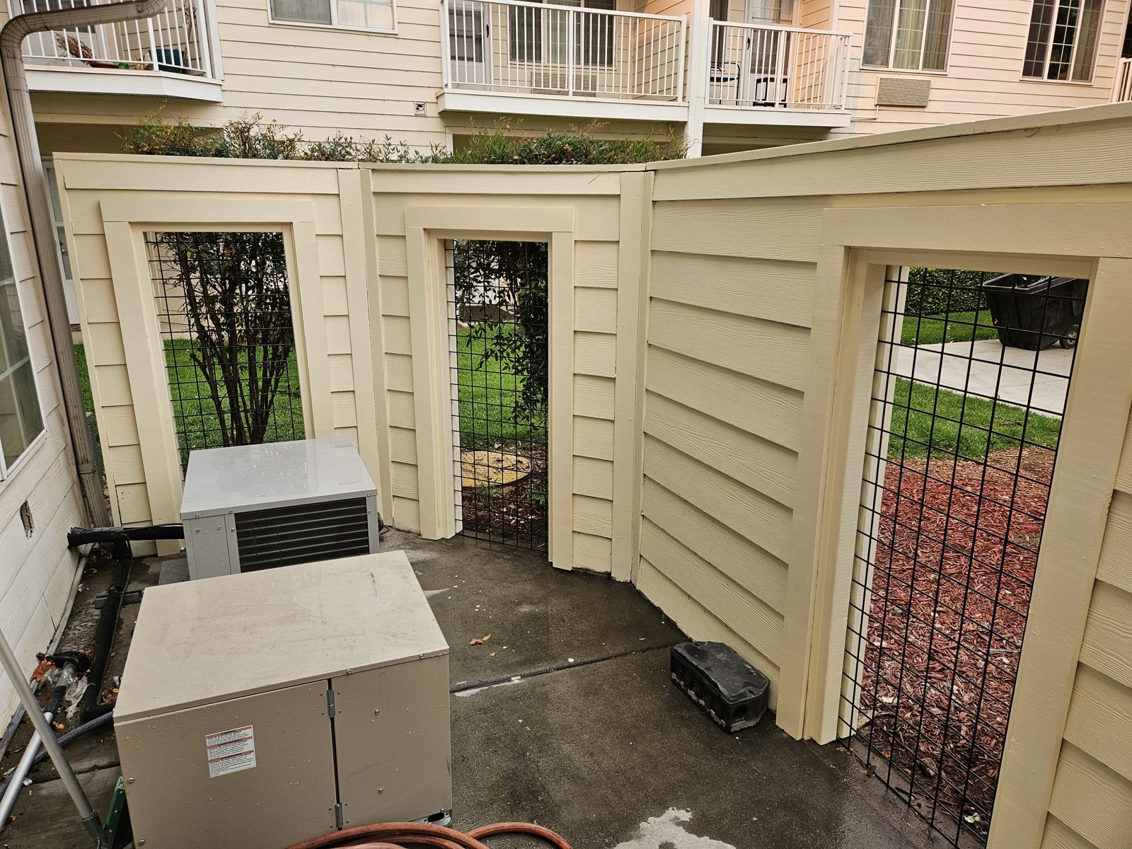 Custom wood enclosure built around an air conditioning unit