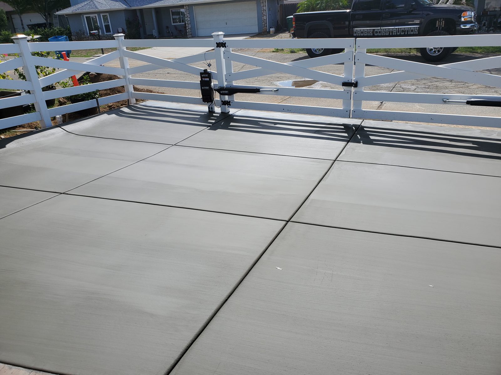 Concrete driveway with a custom built gate