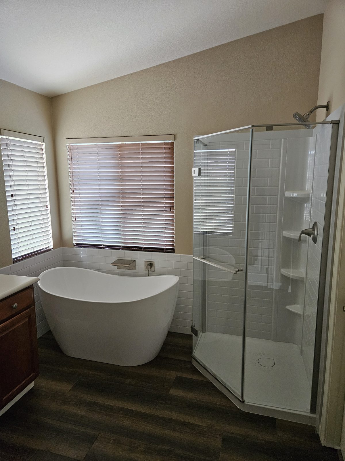 Shower insert and free standing tub installed in a bathroom