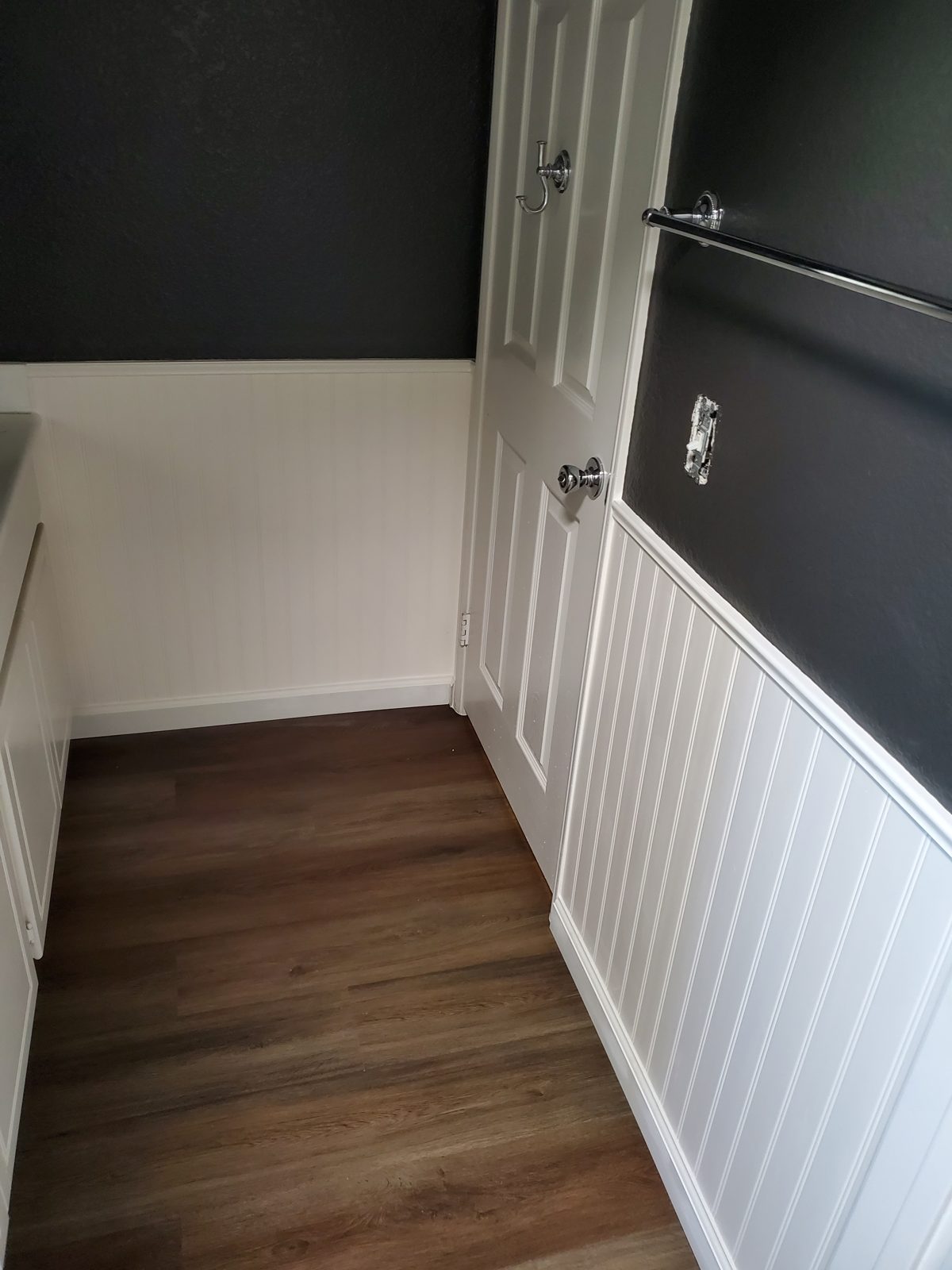 Beadboard wainscoting with chair rail installed in a hallway