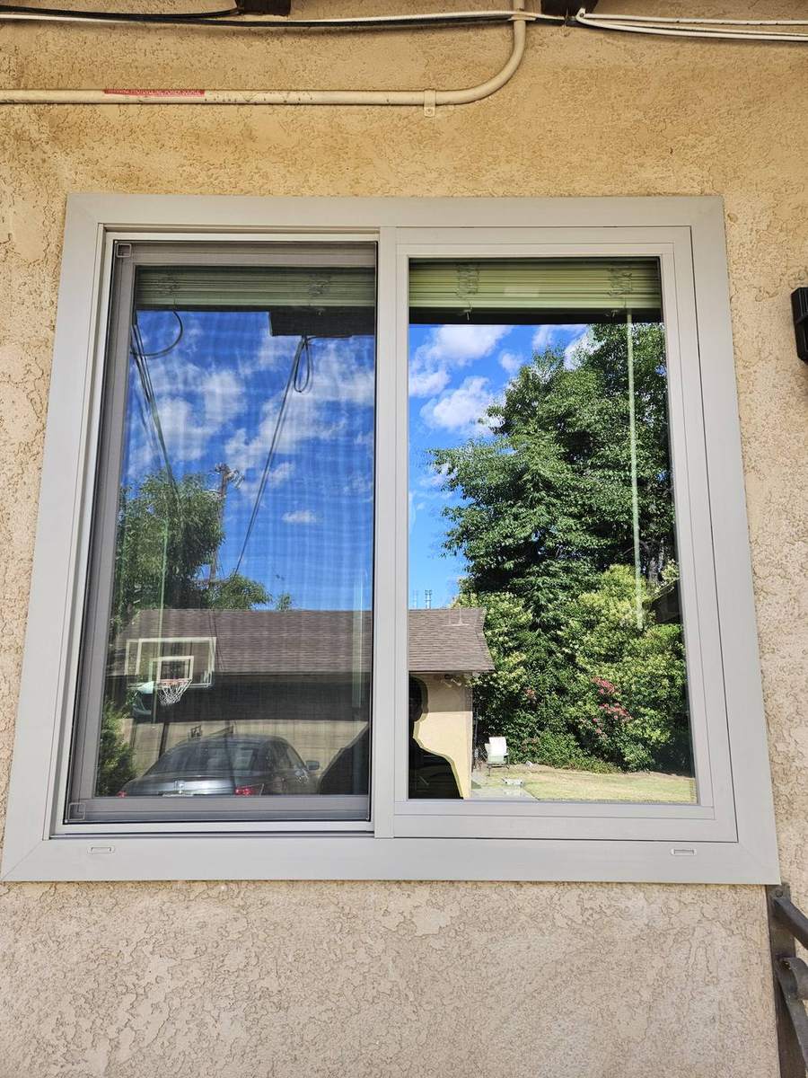 Retrofit window installed in an existing opening
