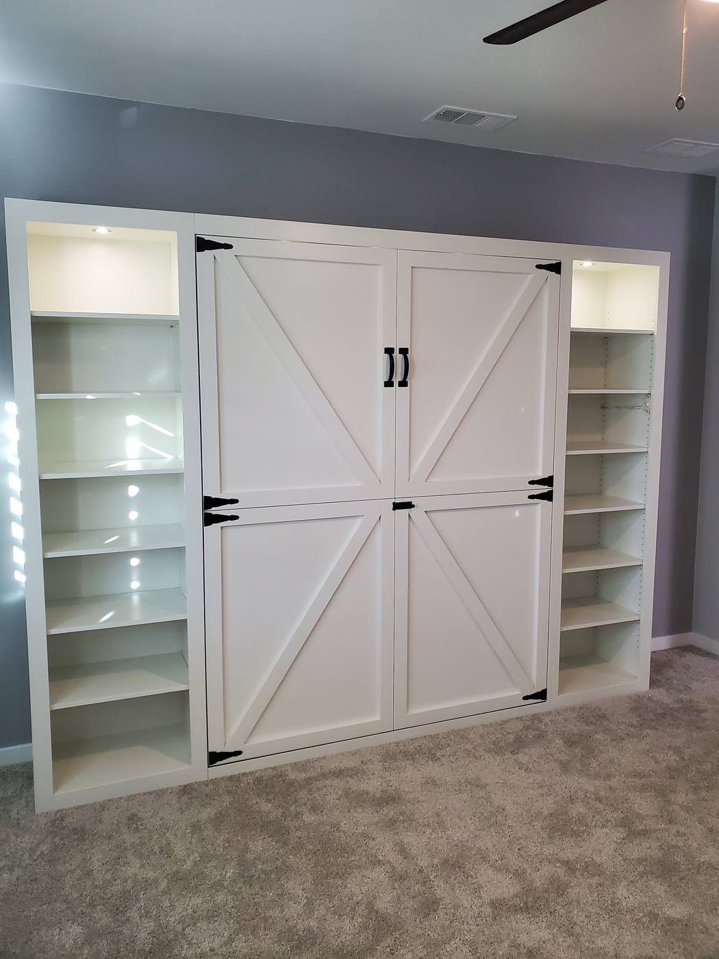Custom built murphy bed folded into the wall