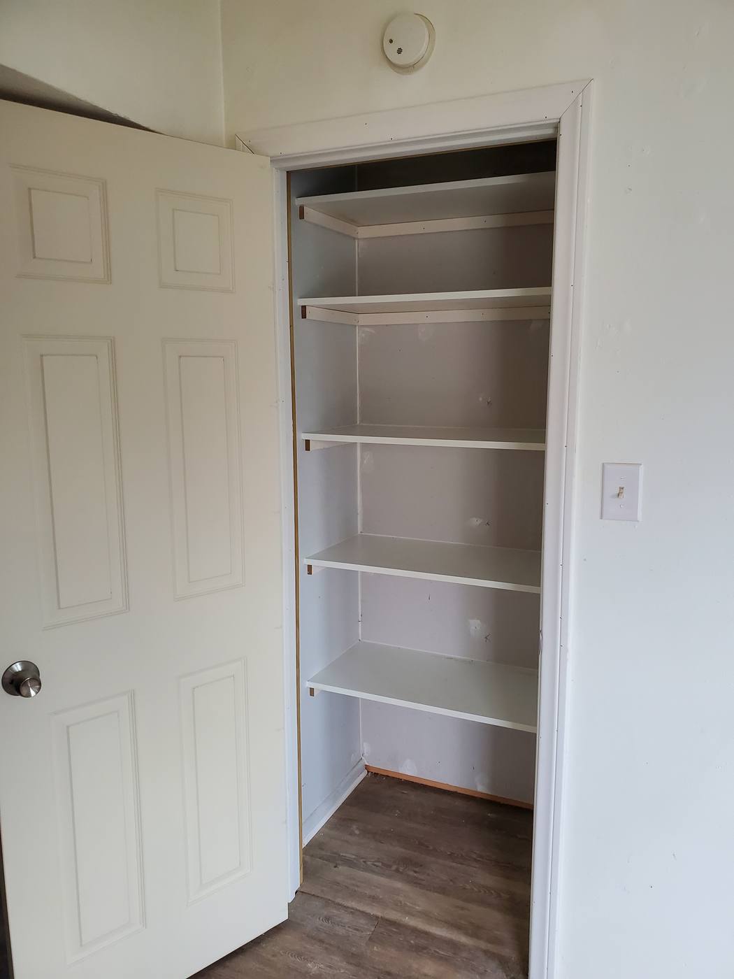 Custom pantry built with full height shelving
