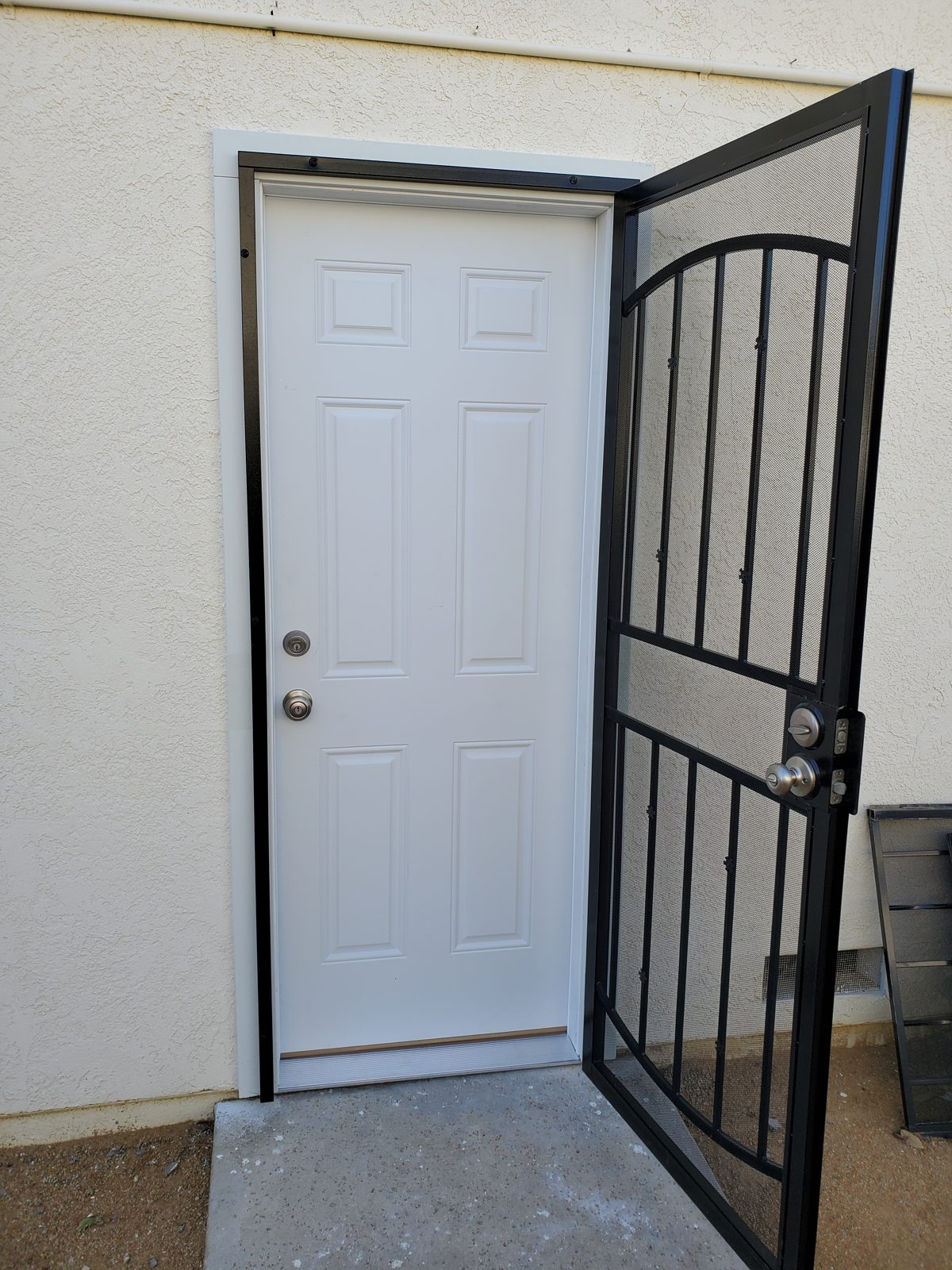 New entry door installed with a security screen