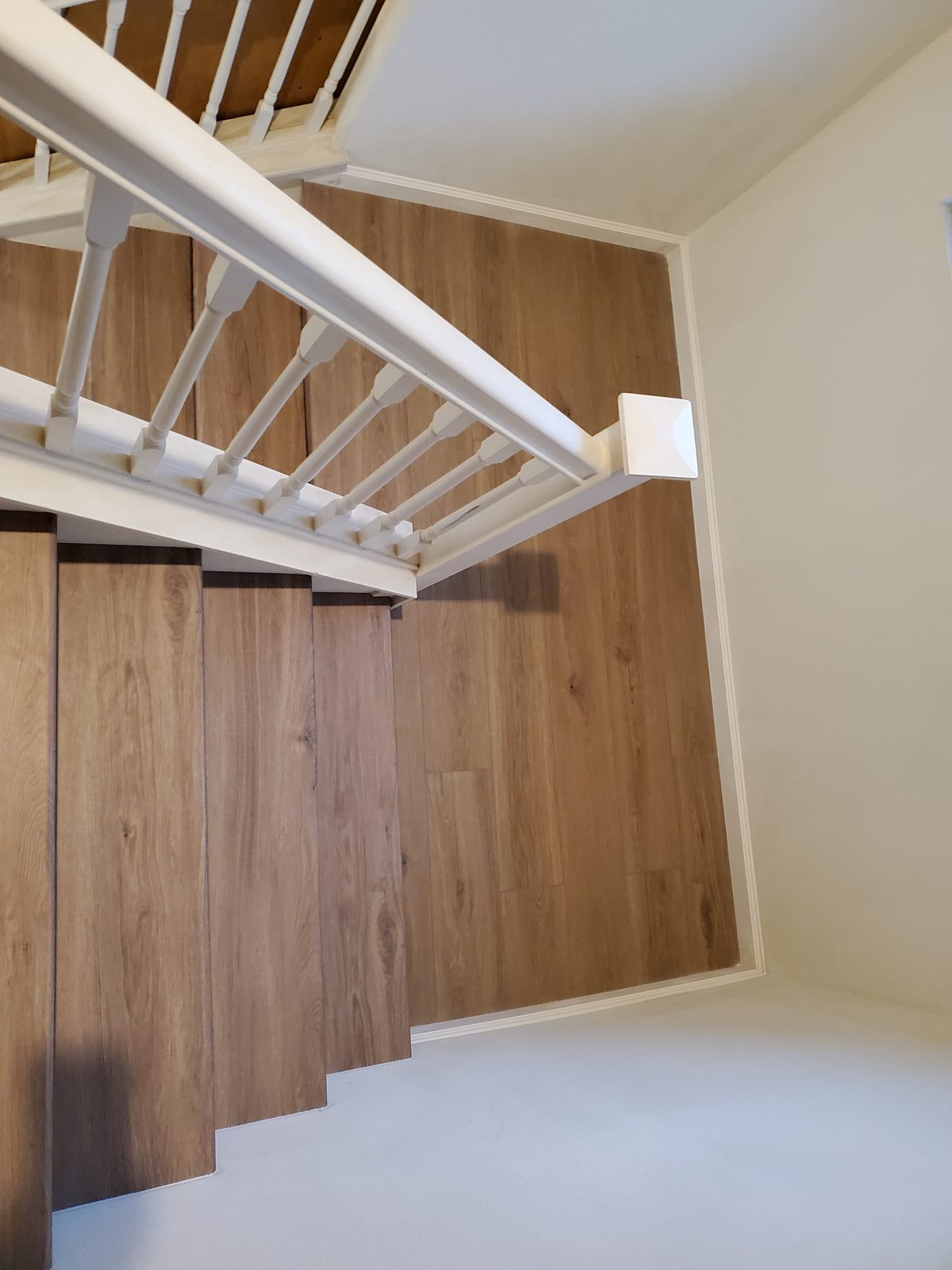 New laminate flooring installed throughout a room